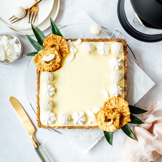 Vegan No-Bake Piña Colada Ice Cream Tart with coconut cream and pineapple
