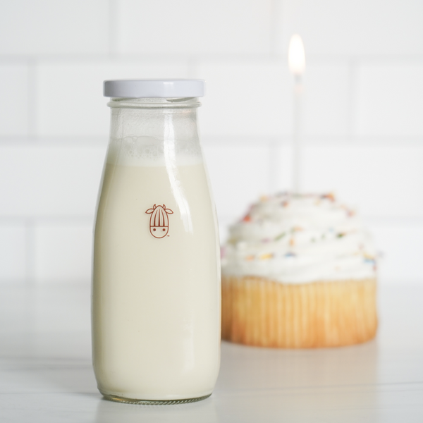 vegan birthday cake creamer in a almond cow glass bottle
