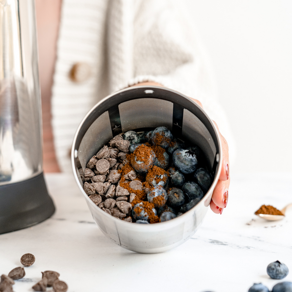 blueberries, chocolate chips, instant coffee in a Almond Cow filter basket to make a blueberry mocha infusion