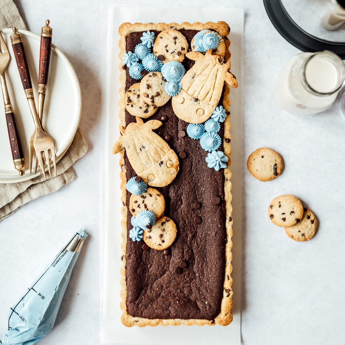 Brookie (Brownie& Cookie) Tart with blue frosting and cow shaped cookies