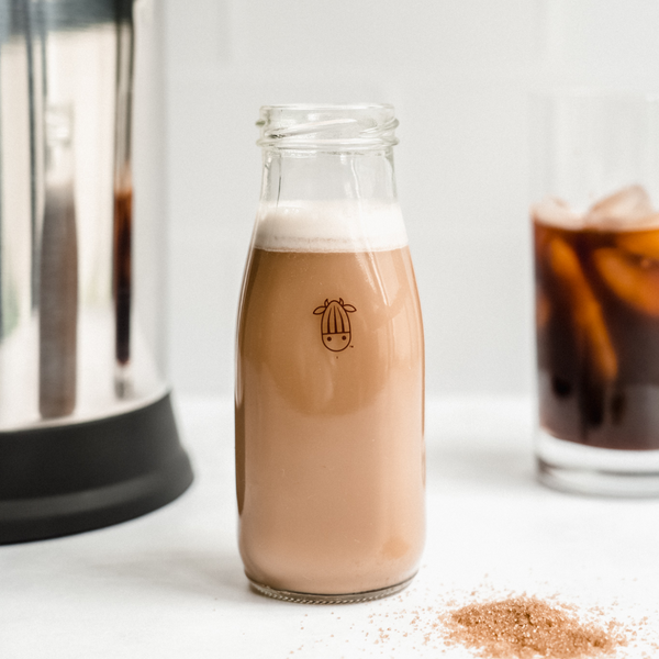 vegan brown sugar creamer in an Almond Cow glass bottle