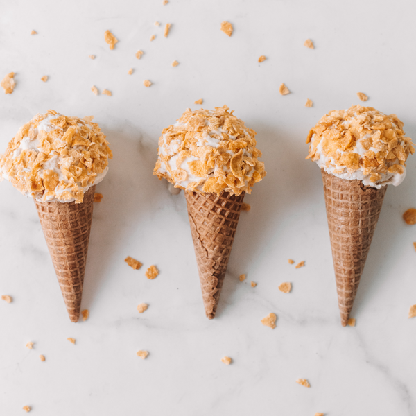 three cones of vegan Cereal Milk Ice Cream