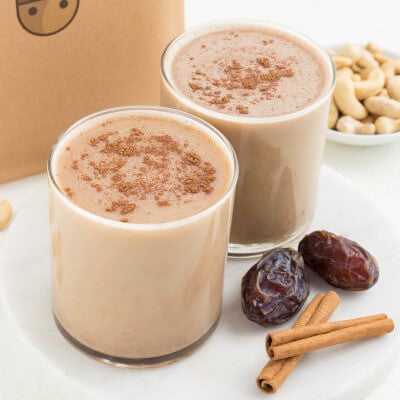 vegan cashew milk chai lattes next to cinnamon and dates