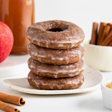 stack of vegan chai spiced donuts with apple cider glaze