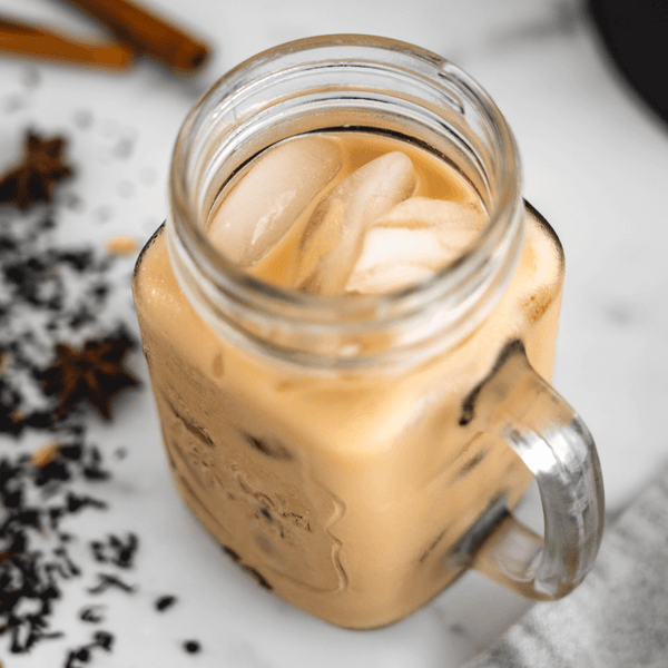 glass of plant-based cold brew chai milk