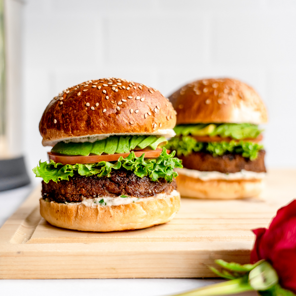 vegan burger with lettuce, avocado, tomato on a bun