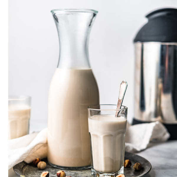 a jug and glass of Hazelnut Milk