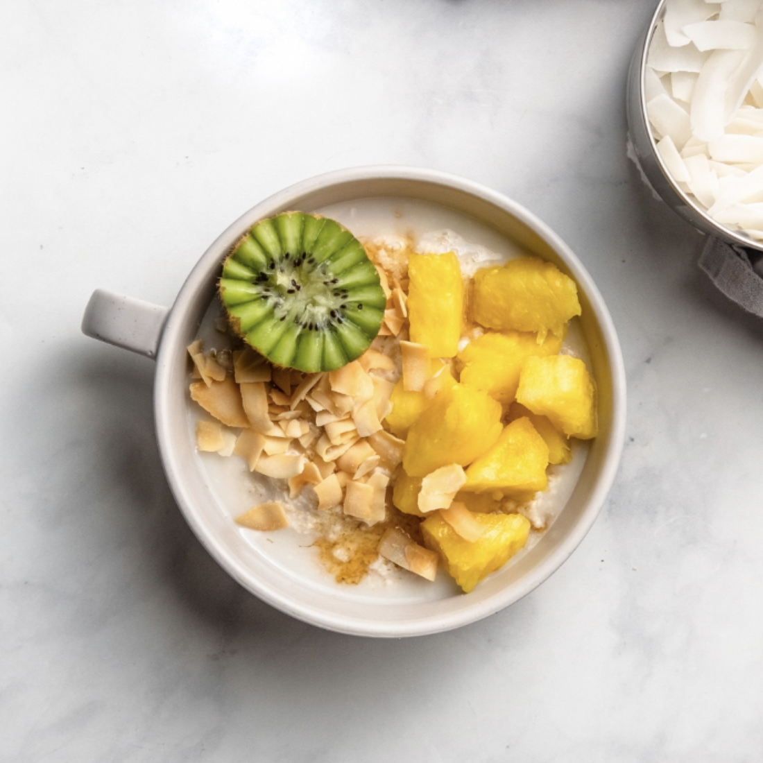 vegan kiwi pineapple coconut pulpmeal in a bowl