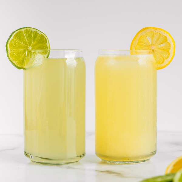 a glass of limeade and lemonade made in the almond cow