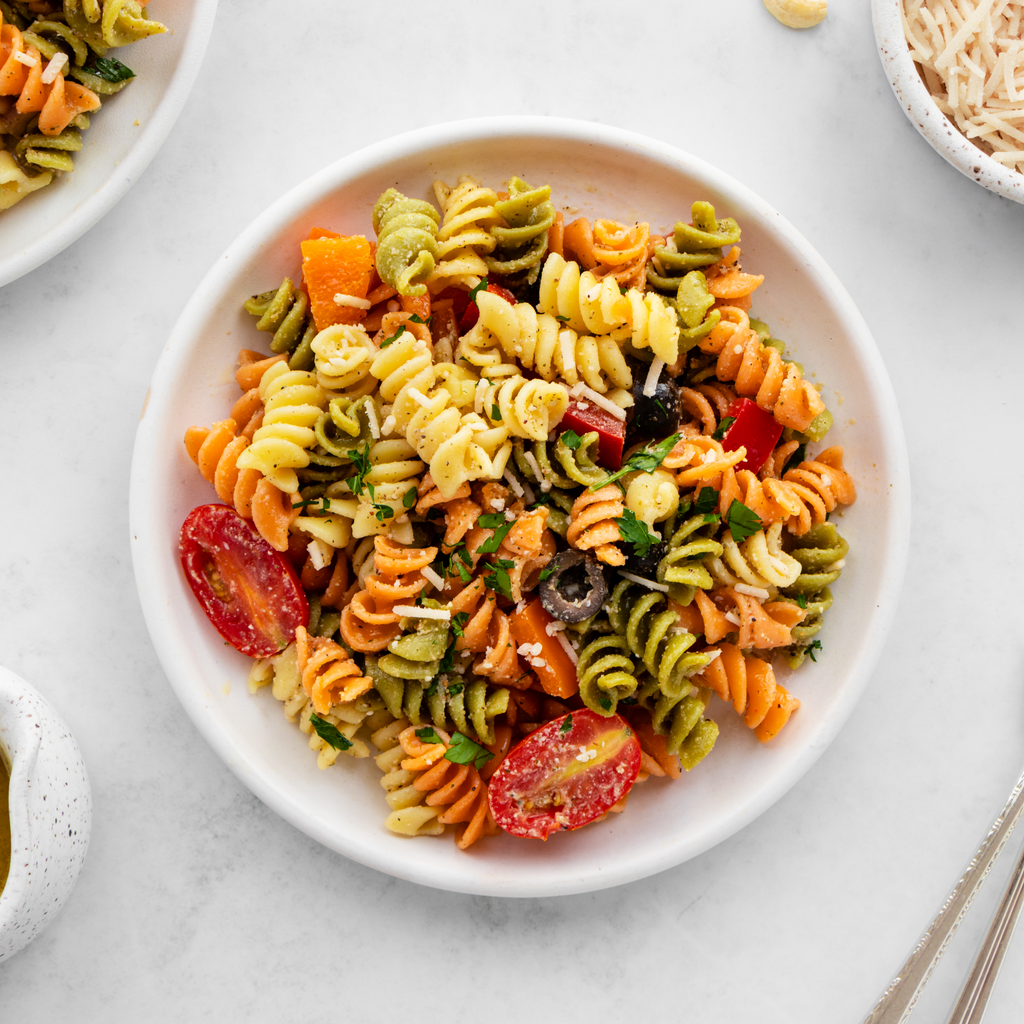 Pasta Salad with Italian dressing, tomatoes, and onion.
