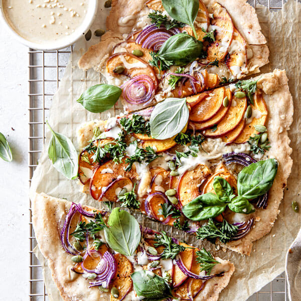 A vegan pizza cut into slices