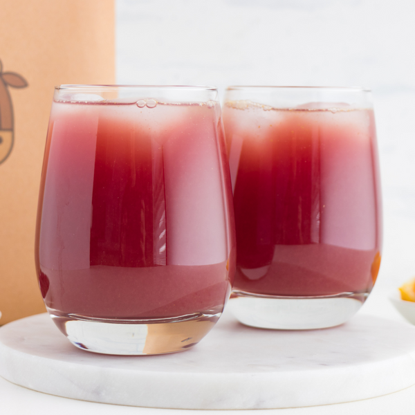 glasses of Pomegranate Punch made with an almond cow