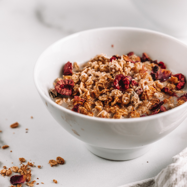 a bowl of raspberry rose granola using leftover pulp from the Almond Cow