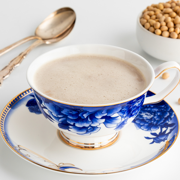 Royal milk tea in a tea cup with soy beans in a bowl