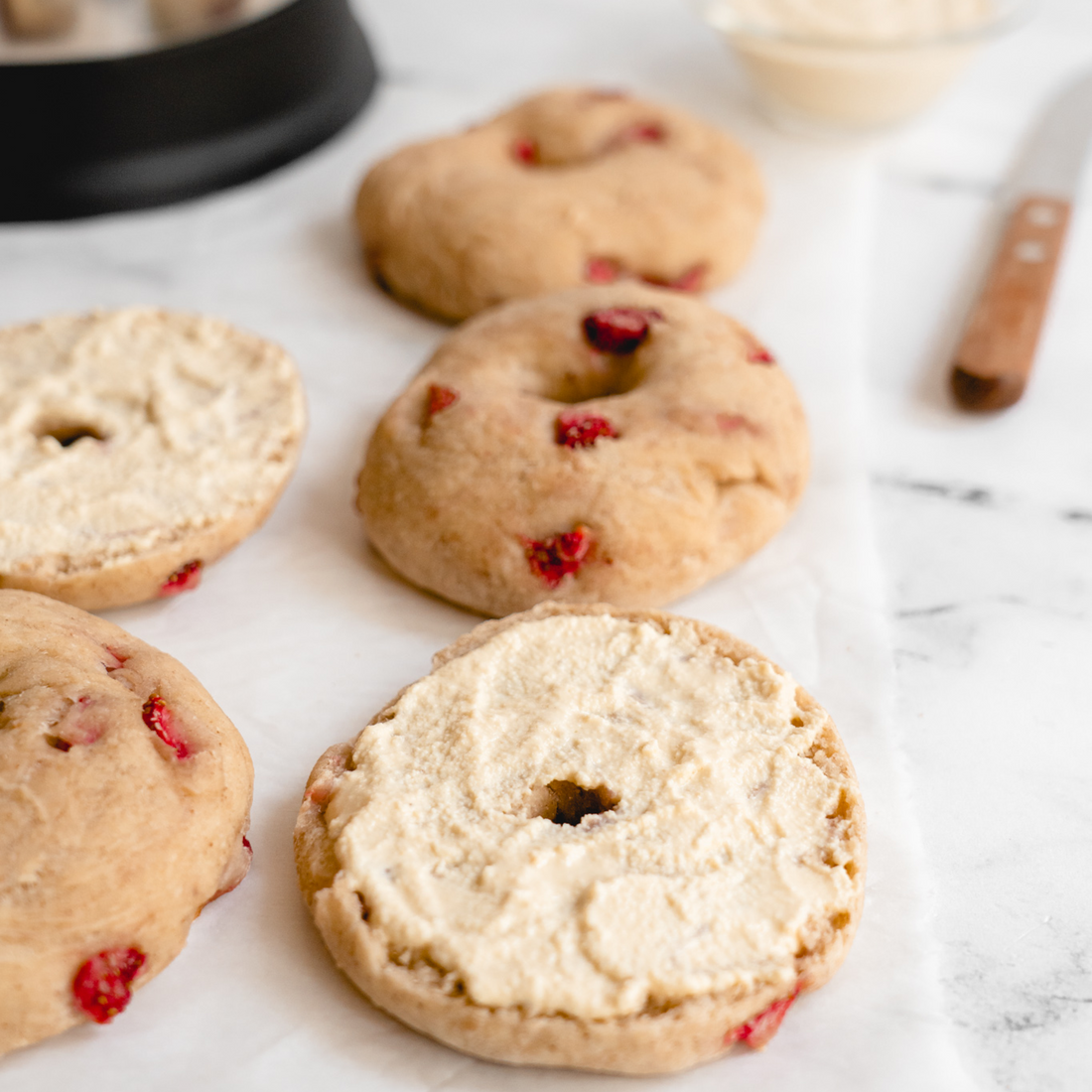 vegan strawberry bagel with vegan vanilla cream cheese