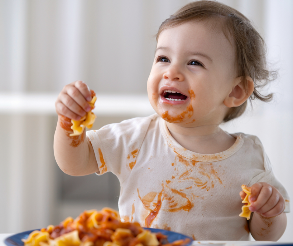 baby eating plant-based pasta 