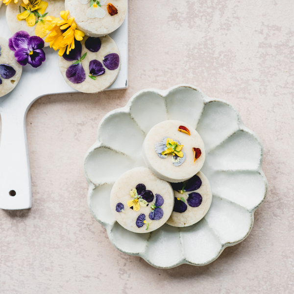 vegan shortbread cookies with edible flowers on a plate