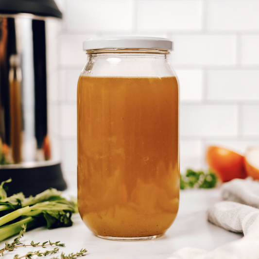 glass container of vegan vegetable broth