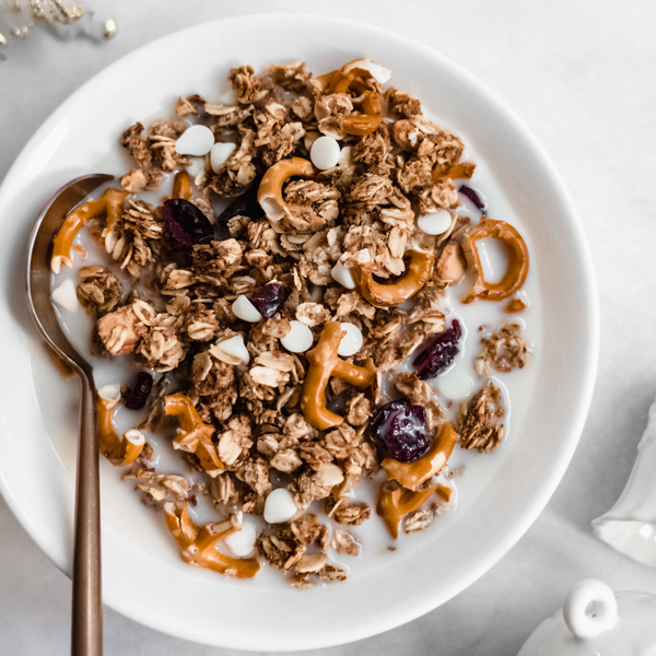 vegan winter mix granola in a bowl with plant-based milk