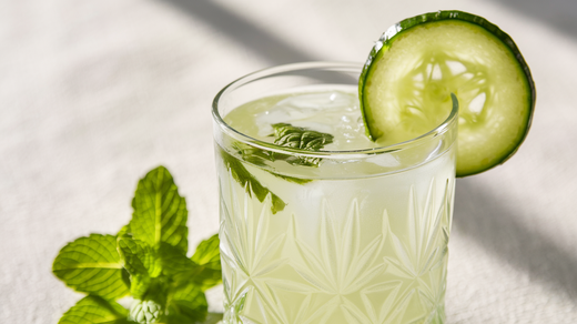 A beautiful cucumber mocktail made with the Almond Cow. It's light green color showcases the cucumber, mint, and lime within. 