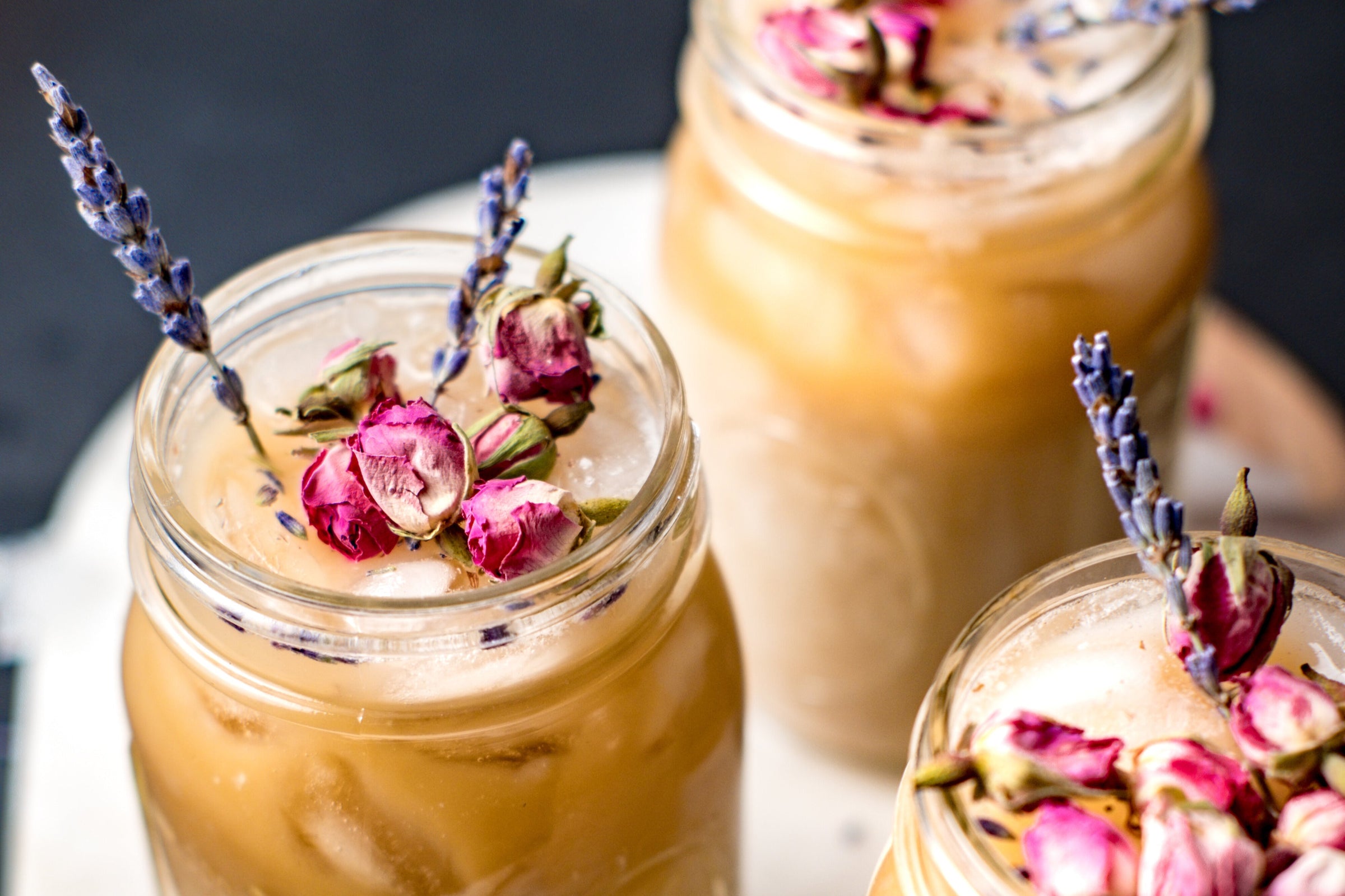 lattes featuring dried lavender and rose petals for garnish.