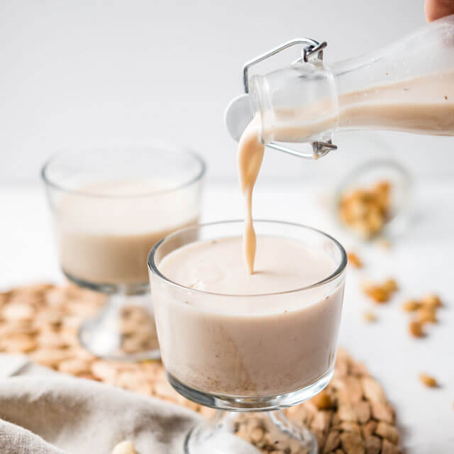 homemade Macaflower Milk being poured into a glass