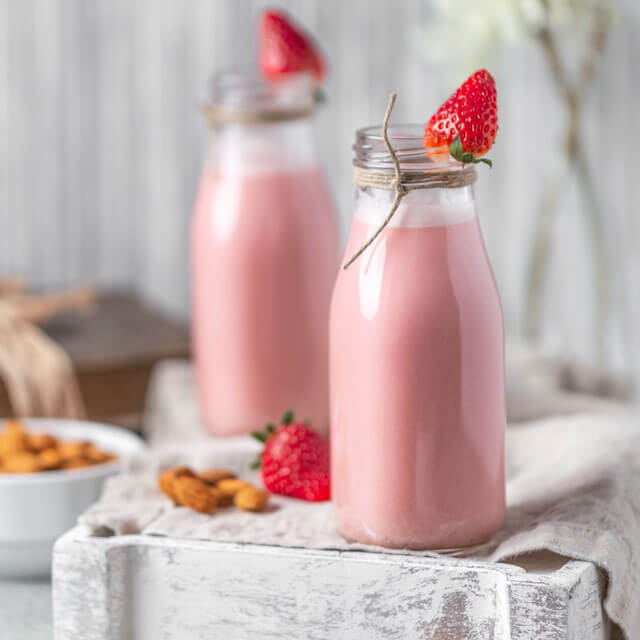 Strawberry Red Beet Almond Milk in two glasses