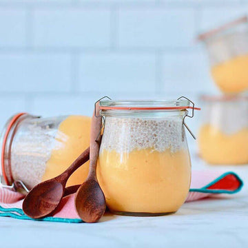 mango chia jars with two spoons