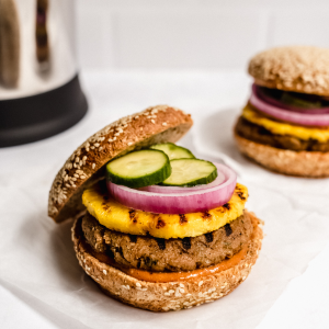 vegan Hawaiian BBQ Burger with grilled pineapple, onion, and pickles