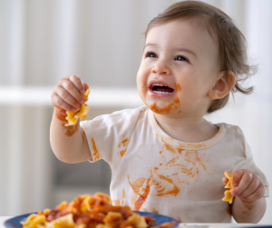 baby eating plant-based pasta